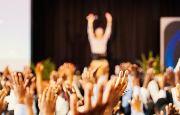 crowd with hands up